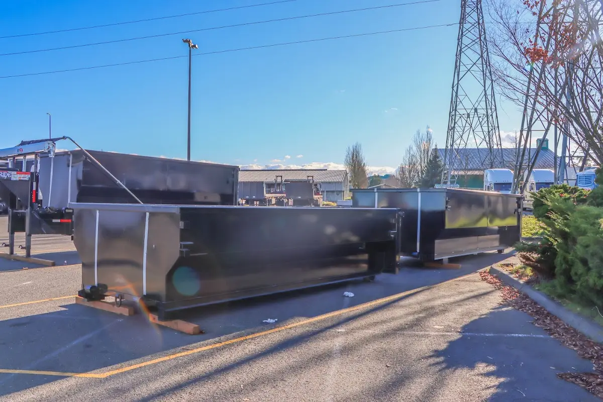 Roll-off dumpster ready for waste disposal at job site for 15 Yard Dumpster Rental in Bemiss